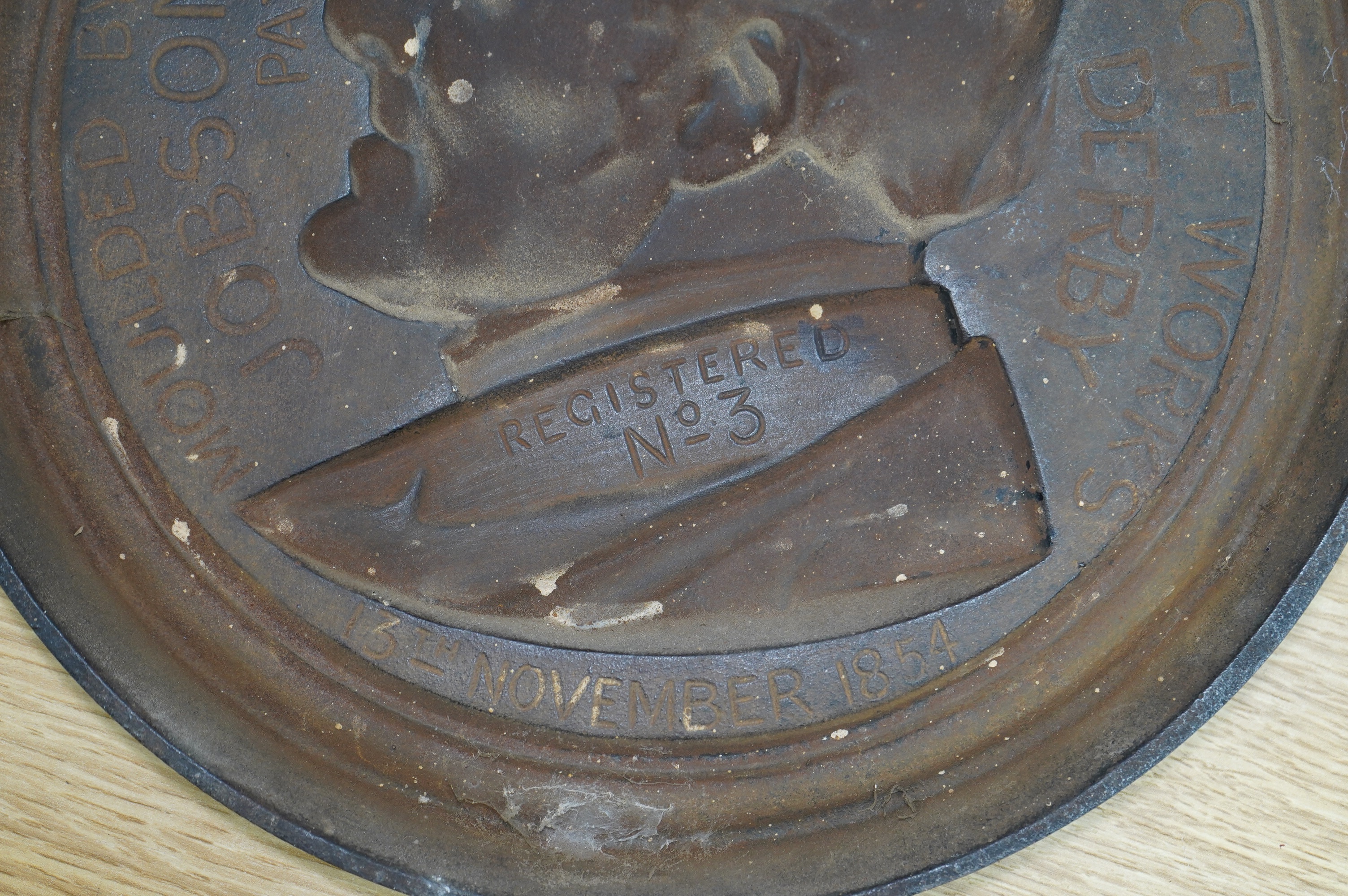 A cast iron profile of the Duke of Wellington, inscribed verso 'Moulded by Jobson's Patent Process, Litchurch, Derby, Registered No. 3, 13th November 1854'. Condition - good
